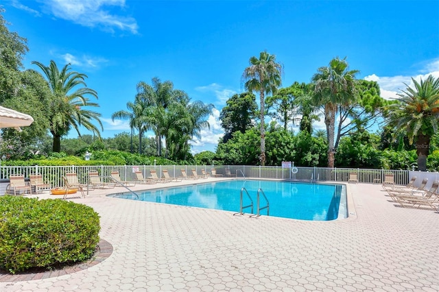 4208 Balmoral Way, Sarasota, FL 34238 - community pool with a patio area and view of wooded area