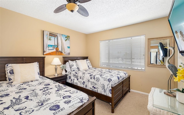 1608 Stickney Point Rd Unit 304, Sarasota, FL 34231 - bedroom featuring carpet flooring, a ceiling fan, a textured ceiling, and baseboards