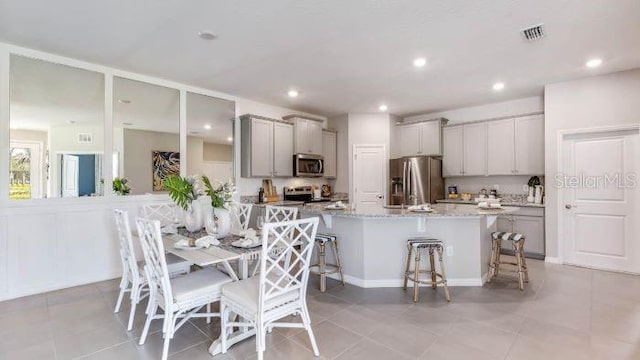 18105 Cropside Trl, Lakewood Ranch, FL 34211 - dining space featuring light tile patterned floors and recessed lighting