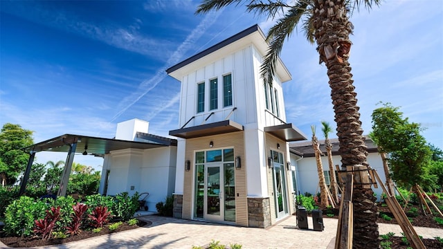 18105 Cropside Trl, Lakewood Ranch, FL 34211 - rear view of house with board and batten siding