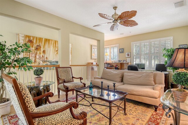 6552 Moorings Point Cir Unit 201, Lakewood Ranch, FL 34202 - living room featuring a ceiling fan