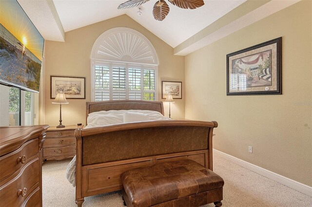 6552 Moorings Point Cir Unit 201, Lakewood Ranch, FL 34202 - bedroom featuring light carpet, lofted ceiling, and baseboards