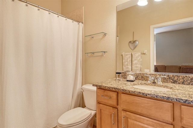 6552 Moorings Point Cir Unit 201, Lakewood Ranch, FL 34202 - bathroom featuring toilet, a textured wall, vanity, and a shower with curtain