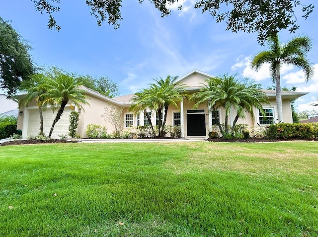 13809 18th Pl E, Bradenton, FL 34212 - single story home with stucco siding, an attached garage, a front yard, and driveway
