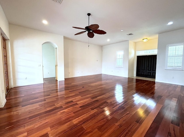 13809 18th Pl E, Bradenton, FL 34212 - unfurnished living room with a ceiling fan, arched walkways, wood finished floors, plenty of natural light, and recessed lighting