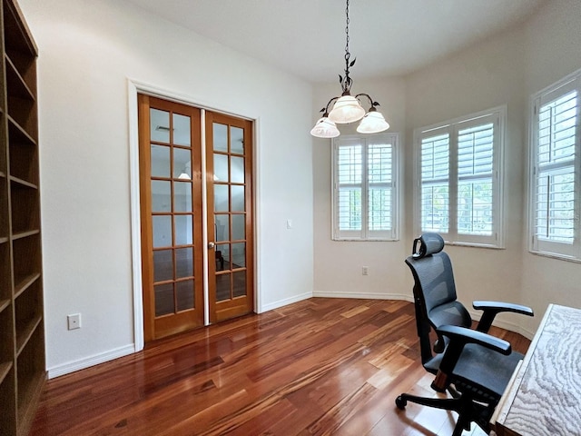 13809 18th Pl E, Bradenton, FL 34212 - office area featuring french doors, wood finished floors, healthy amount of natural light, and baseboards