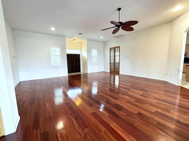 13809 18th Pl E, Bradenton, FL 34212 - unfurnished living room with wood finished floors, plenty of natural light, ceiling fan, recessed lighting, and baseboards