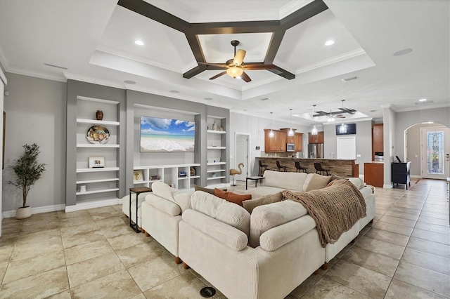 15208 21st Ave E, Bradenton, FL 34212 - living area with a ceiling fan, built in shelves, arched walkways, ornamental molding, and baseboards