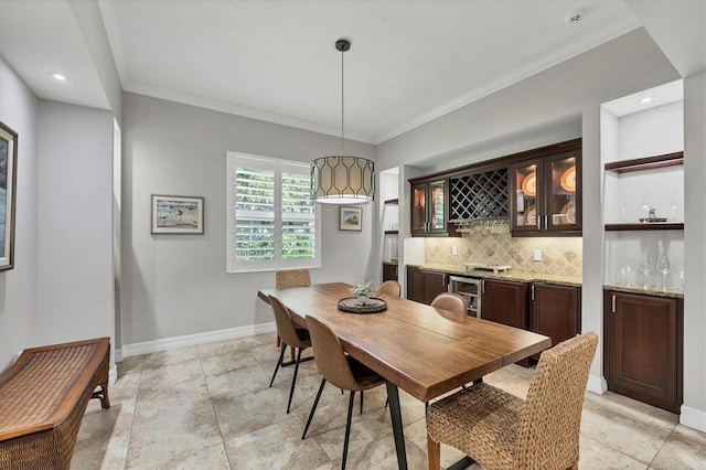 15208 21st Ave E, Bradenton, FL 34212 - dining space featuring bar with sink, baseboards, crown molding, and recessed lighting