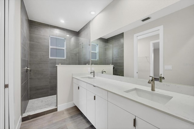 2258 Margaret Ln, North Port, FL 34286 - full bathroom with a walk in shower, double vanity, wood finished floors, recessed lighting, and a spacious closet