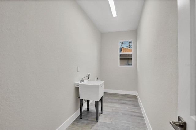2258 Margaret Ln, North Port, FL 34286 - laundry room with washer hookup, light wood-style flooring, and hookup for an electric dryer
