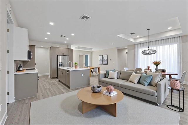 2258 Margaret Ln, North Port, FL 34286 - living room with light wood finished floors and recessed lighting