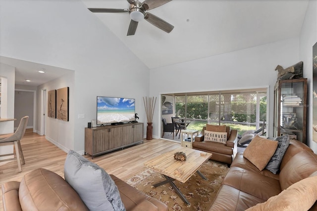 7160 Cedar Hollow Cir, Bradenton, FL 34203 - living room with high vaulted ceiling, a ceiling fan, light wood-style floors, and baseboards