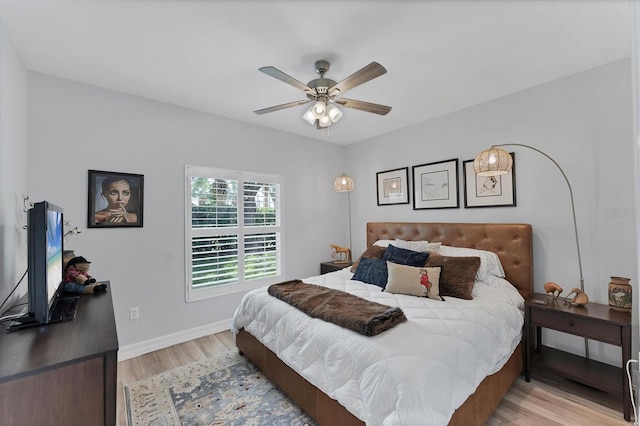7160 Cedar Hollow Cir, Bradenton, FL 34203 - bedroom featuring light wood finished floors, baseboards, and ceiling fan