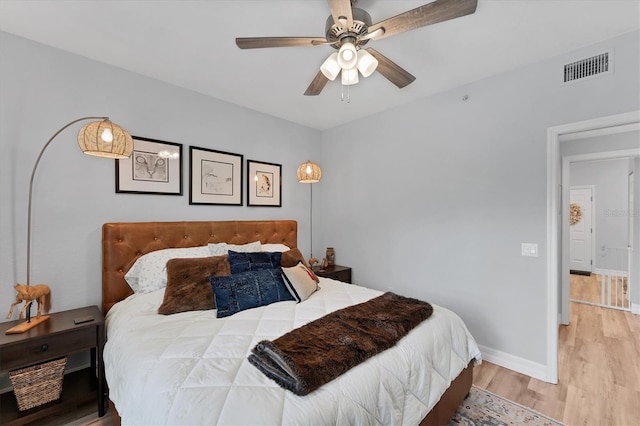 7160 Cedar Hollow Cir, Bradenton, FL 34203 - bedroom with wood finished floors, baseboards, and ceiling fan