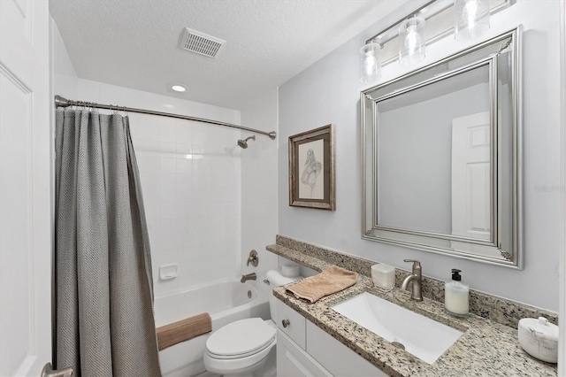 7160 Cedar Hollow Cir, Bradenton, FL 34203 - full bathroom featuring toilet, vanity, shower / bath combo with shower curtain, and a textured ceiling
