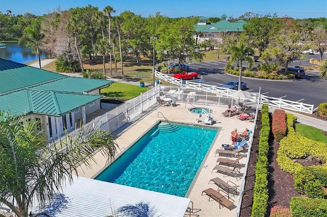 7160 Cedar Hollow Cir, Bradenton, FL 34203 - community pool featuring a fenced backyard and a patio