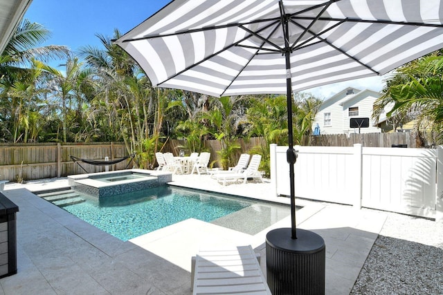 2908 Gulf Dr, Holmes Beach, FL 34217 - view of pool featuring a patio area, a fenced backyard, and a pool with connected hot tub