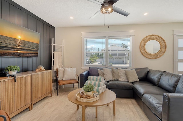2908 Gulf Dr, Holmes Beach, FL 34217 - living area featuring light wood-style flooring, a ceiling fan, recessed lighting, and wood walls