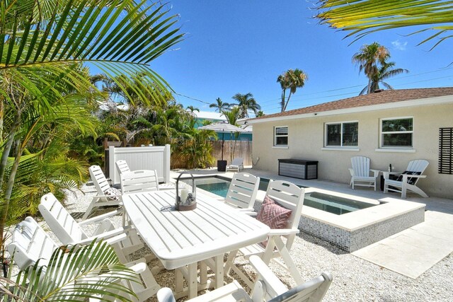2908 Gulf Dr, Holmes Beach, FL 34217 - view of patio / terrace with an outdoor fire pit, fence, and outdoor dining space