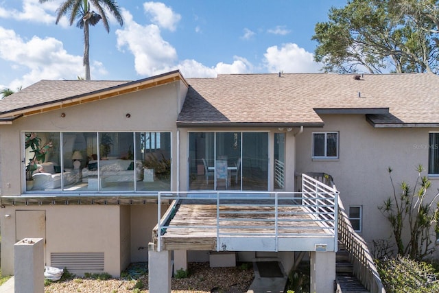 5912 Riverview Ln, Bradenton, FL 34209 - rear view of house with stucco siding and a shingled roof