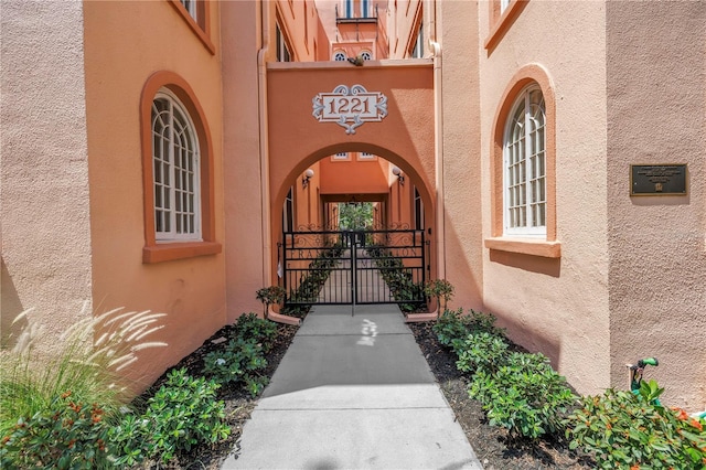1221 N Palm Ave Unit 303, Sarasota, FL 34236 - entrance to property with stucco siding and a gate