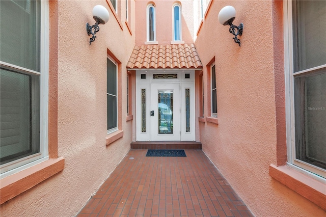 1221 N Palm Ave Unit 303, Sarasota, FL 34236 - property entrance with a tiled roof and stucco siding