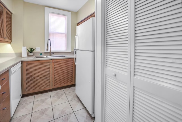 1221 N Palm Ave Unit 303, Sarasota, FL 34236 - kitchen featuring white appliances, a sink, and light countertops