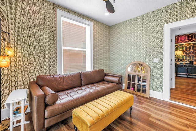1221 N Palm Ave Unit 303, Sarasota, FL 34236 - living room with wallpapered walls, wood finished floors, and baseboards