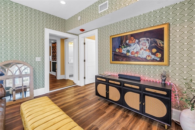 1221 N Palm Ave Unit 303, Sarasota, FL 34236 - living area with wallpapered walls, wood finished floors, baseboards, and recessed lighting