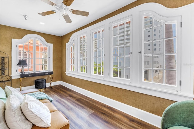 1221 N Palm Ave Unit 303, Sarasota, FL 34236 - sitting room with baseboards, dark wood-style floors, and a ceiling fan