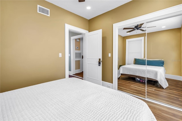 1221 N Palm Ave Unit 303, Sarasota, FL 34236 - bedroom featuring a closet, wood finished floors, a ceiling fan, recessed lighting, and baseboards