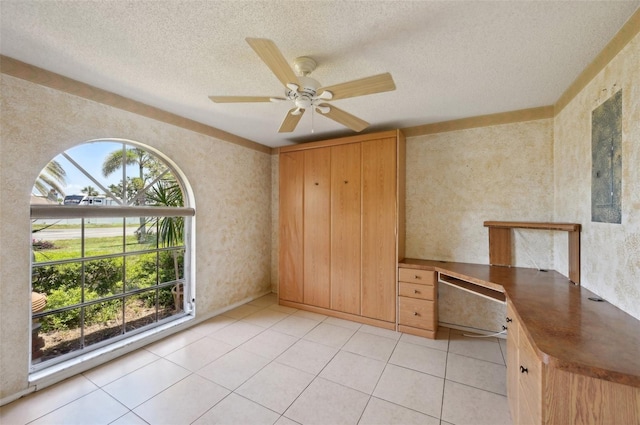 321 Sorrento Dr, Osprey, FL 34229 - unfurnished office featuring a textured ceiling, ceiling fan, light tile patterned floors, and wallpapered walls