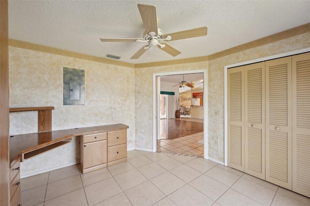 321 Sorrento Dr, Osprey, FL 34229 - unfurnished office featuring a ceiling fan, a textured ceiling, and light tile patterned flooring