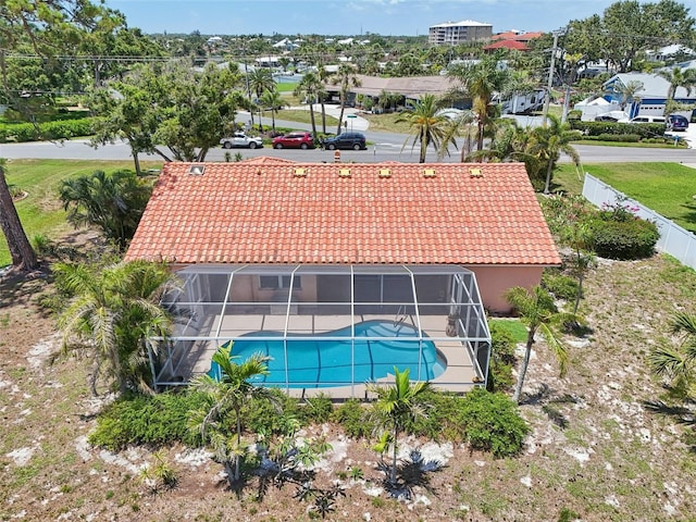 321 Sorrento Dr, Osprey, FL 34229 - rear view of house featuring a tiled roof, an outdoor pool, a lanai, and stucco siding