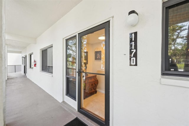 1170 Bird Bay Way Unit 206, Venice, FL 34285 - doorway to property featuring stucco siding