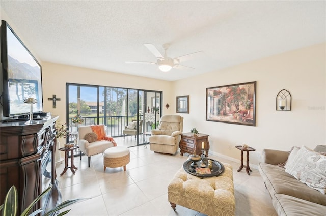1170 Bird Bay Way Unit 206, Venice, FL 34285 - living area featuring light tile patterned flooring, ceiling fan, and baseboards