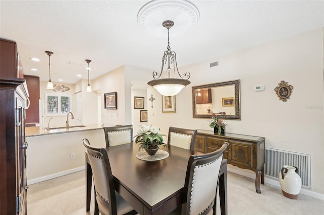1170 Bird Bay Way Unit 206, Venice, FL 34285 - dining room featuring baseboards and recessed lighting