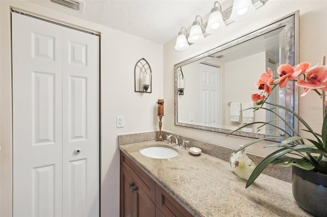 1170 Bird Bay Way Unit 206, Venice, FL 34285 - bathroom featuring vanity and a closet