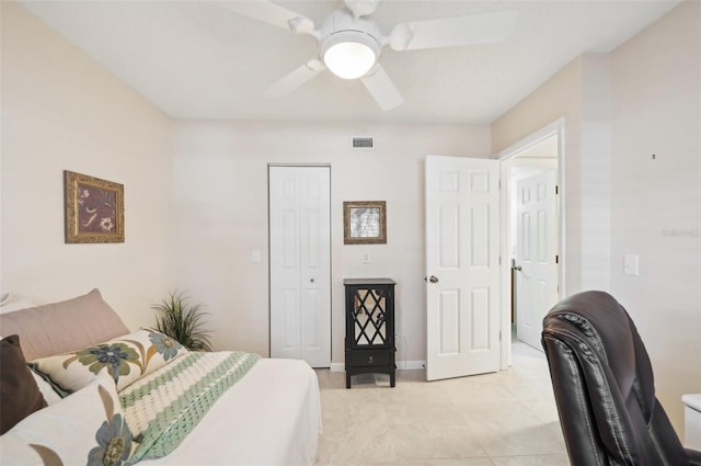 1170 Bird Bay Way Unit 206, Venice, FL 34285 - bedroom with light tile patterned floors, ceiling fan, a closet, and baseboards