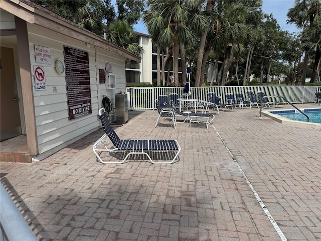 1170 Bird Bay Way Unit 206, Venice, FL 34285 - view of patio / terrace featuring a community pool