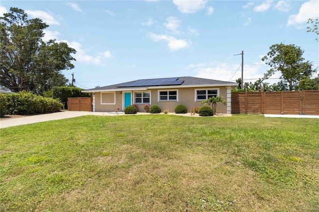 1212 Princeton Ave, Bradenton, FL 34207 - ranch-style house with solar panels, stucco siding, and driveway