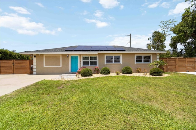 1212 Princeton Ave, Bradenton, FL 34207 - single story home with stucco siding, solar panels, and a gate