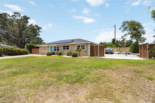1212 Princeton Ave, Bradenton, FL 34207 - ranch-style home featuring solar panels, driveway, and stucco siding