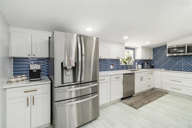 1212 Princeton Ave, Bradenton, FL 34207 - kitchen featuring stainless steel appliances, backsplash, white cabinetry, and recessed lighting