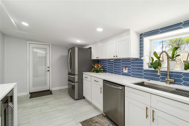1212 Princeton Ave, Bradenton, FL 34207 - kitchen featuring stainless steel appliances, tasteful backsplash, a sink, baseboards, and recessed lighting
