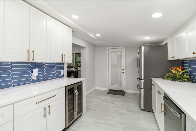 1212 Princeton Ave, Bradenton, FL 34207 - kitchen with stainless steel dishwasher, beverage cooler, white cabinetry, decorative backsplash, and recessed lighting