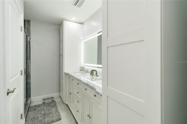 1212 Princeton Ave, Bradenton, FL 34207 - full bathroom featuring baseboards, double vanity, a shower stall, and recessed lighting