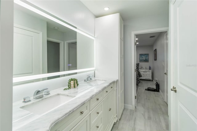 1212 Princeton Ave, Bradenton, FL 34207 - full bathroom with double vanity, baseboards, and recessed lighting