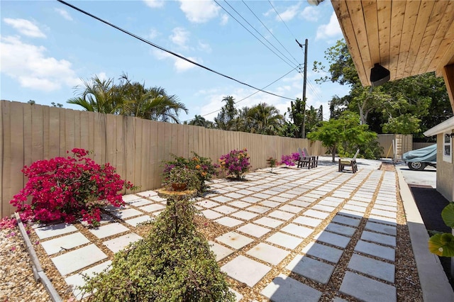 1212 Princeton Ave, Bradenton, FL 34207 - fenced backyard with a patio area